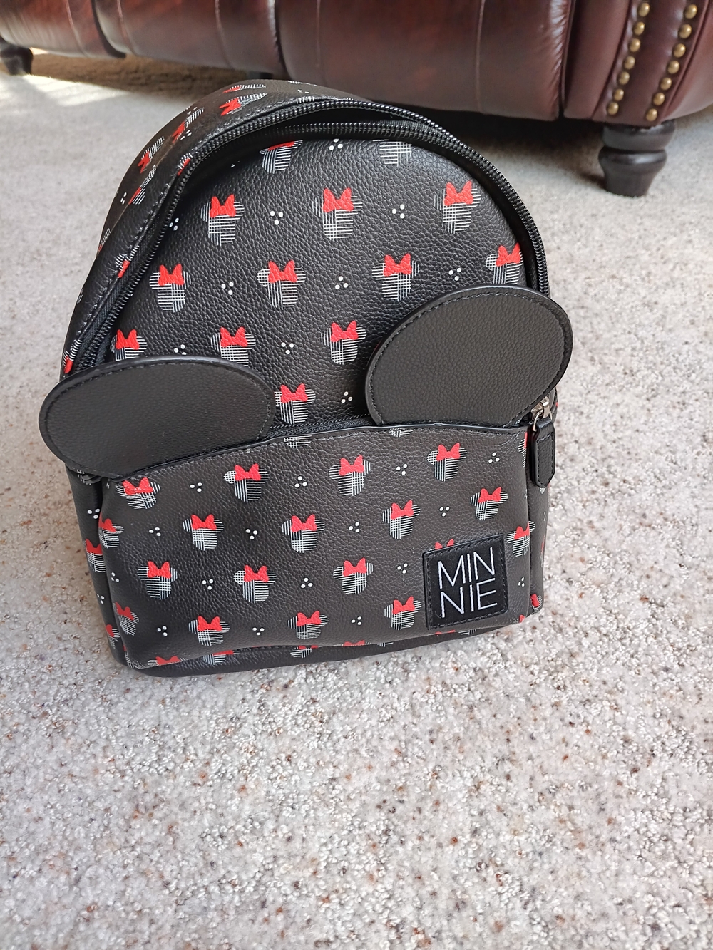 It's youthful...Black and Red Mouse Ear Mini Backpack